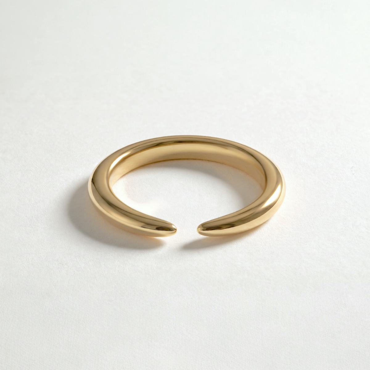 Arc Ring crafted in solid 14K yellow gold, a sculptural modern luxury ring designed for everyday wear.