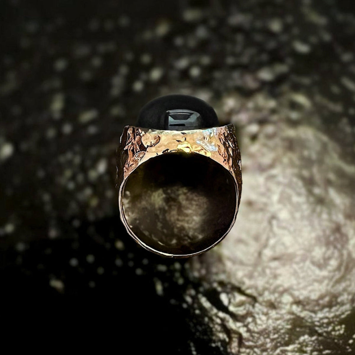 Men's Arroyo gold signet ring with black moonstone cabochon and hand-hammered finish