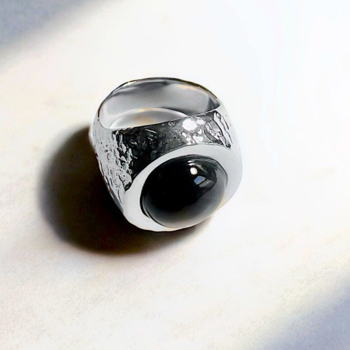 Men's Arroyo silver signet ring with star black moonstone cabochon and hand-hammered finish