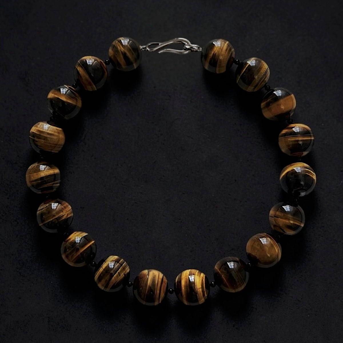 Hera Tiger's Eye statement collar necklace with large natural blue gemstone beads and Sterling silver clasp.