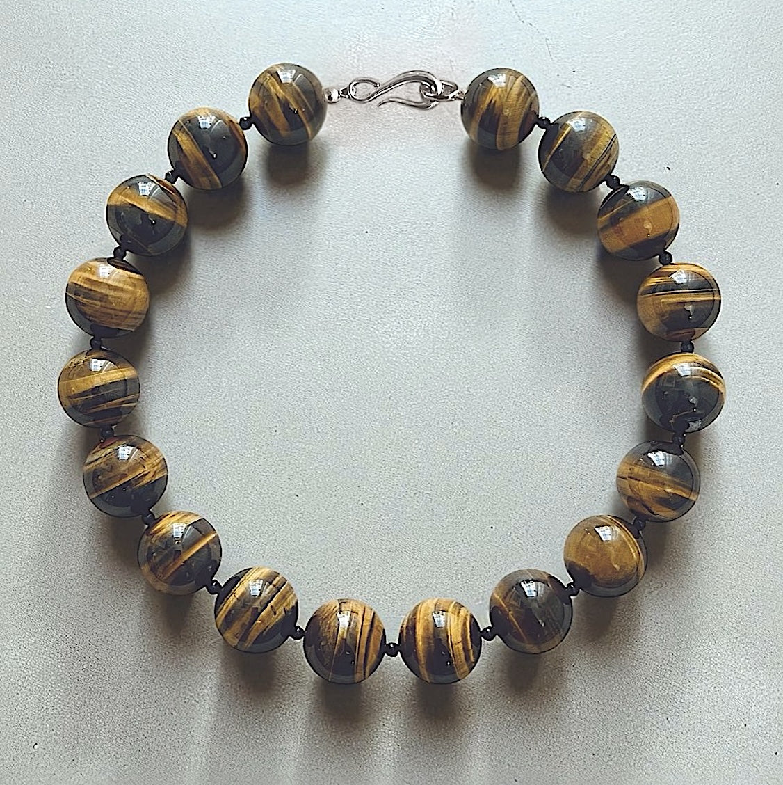 Hera Tiger's Eye collar necklace with large polished Tiger's Eye beads, a luxury statement beaded necklace in sterling silver clasp