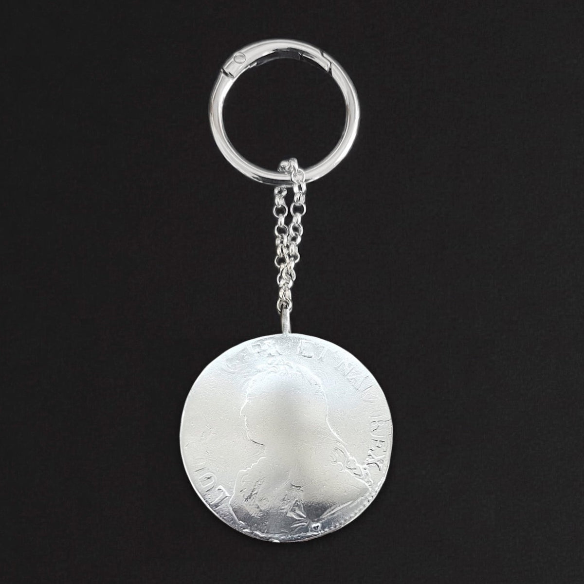 Luxury Louis coin keyring featuring an oversized white bronze medallion suspended from a Sterling silver link chain.