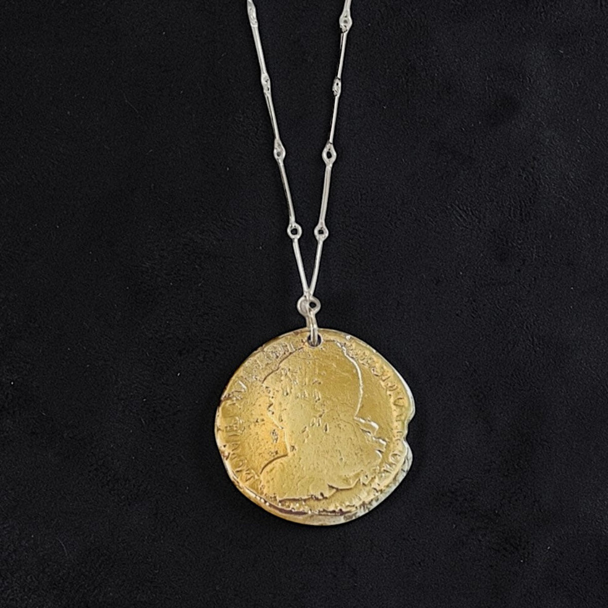 Women's Louis XVI bronze coin pendant necklace handcrafted with a Sterling silver 23-inch link chain, luxury modern heirloom jewelry.