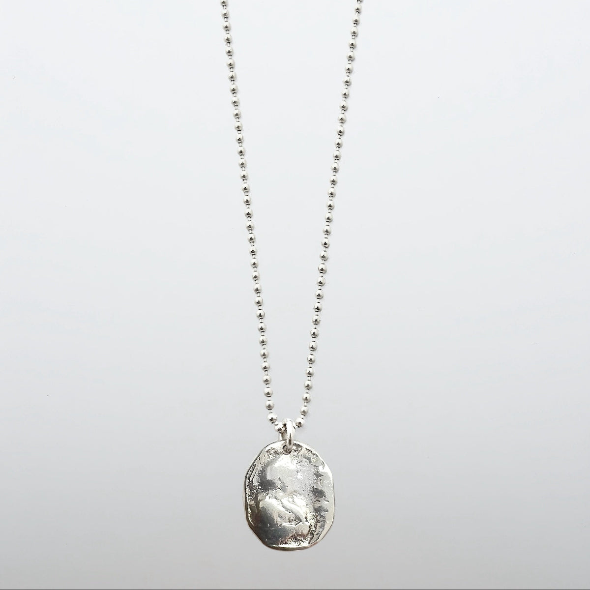 Luxury men's Spanish Prayer Coin necklace handcrafted in Silver and suspended from a 24-inch ball chain.