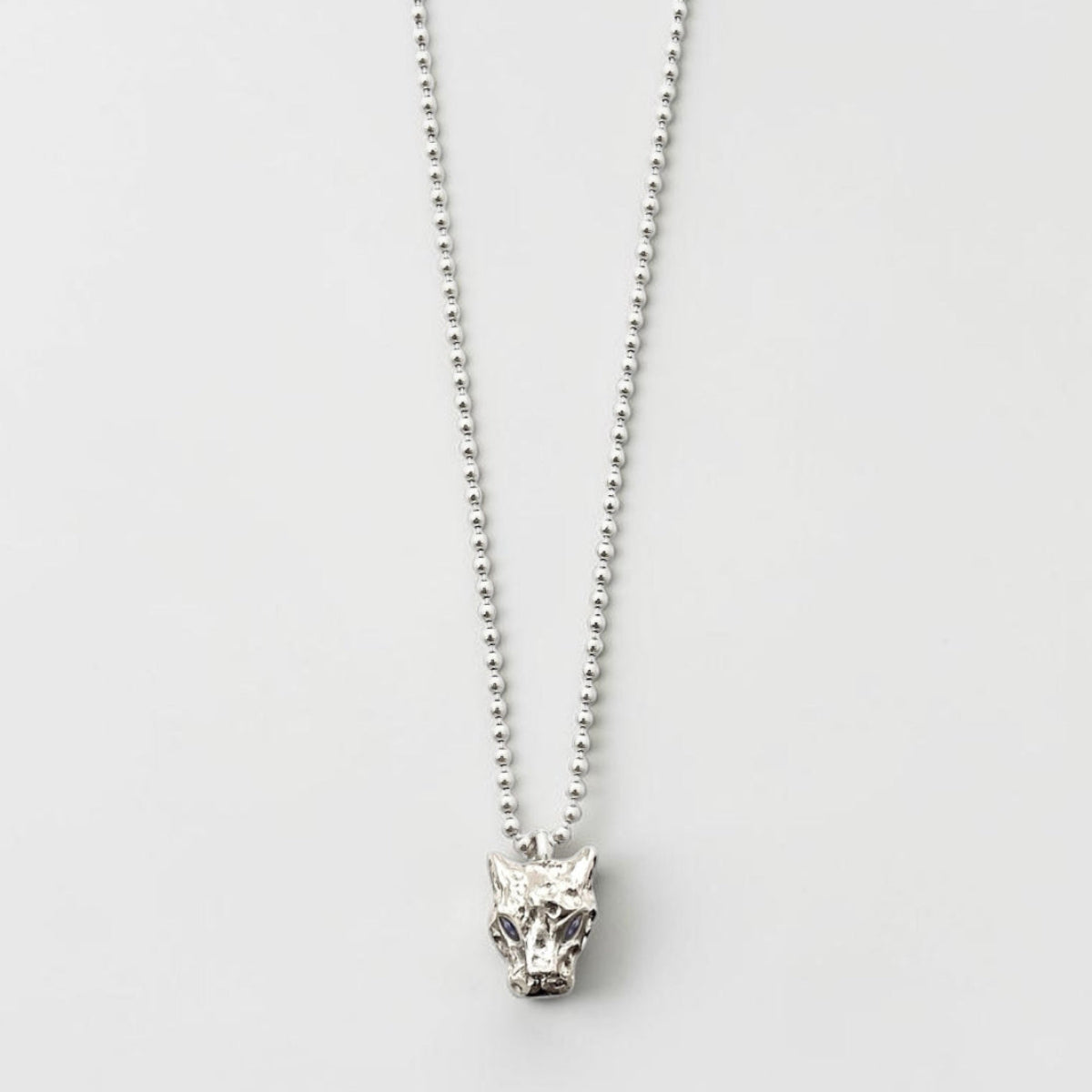 Men's Sterling silver Bastet panther pendant necklace with bezel-set marquise sapphires on a 24-inch ball chain. Inspired by ancient Egyptian mythology.