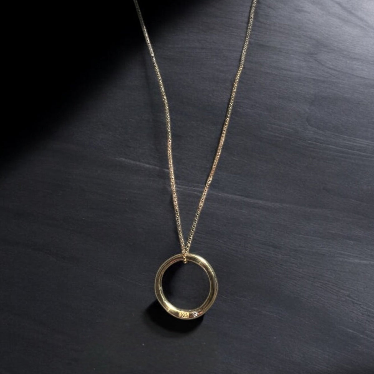 Luxury men's Gold vermeil Eternity pendant necklace with engraved 925 hallmark and bezel-set white diamond on a curb chain.