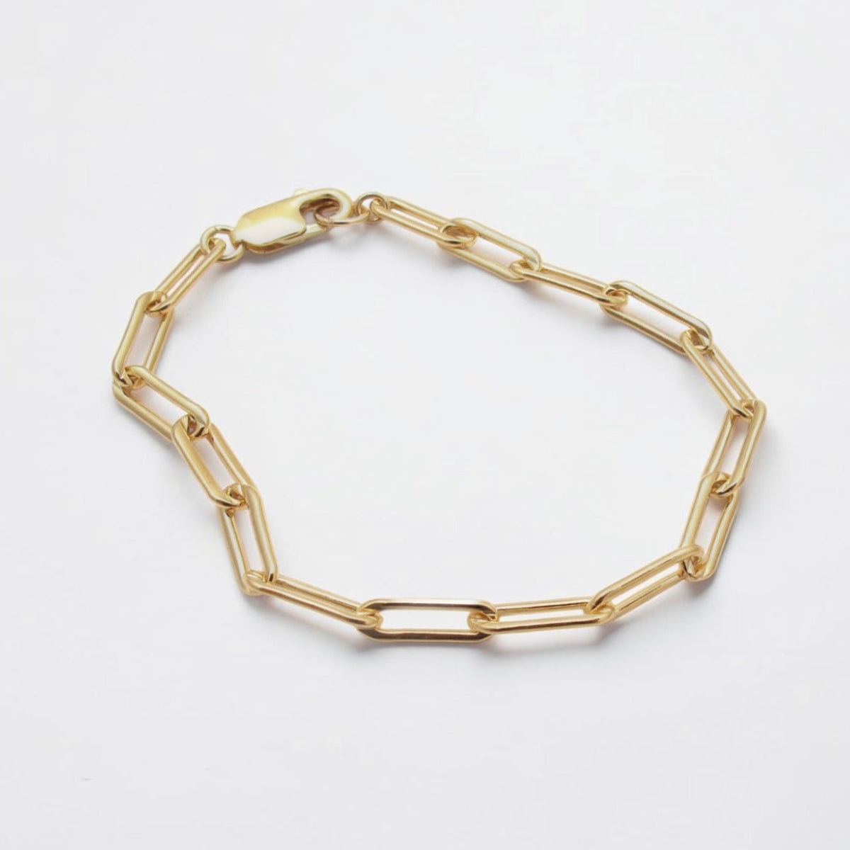 Luxury men's gold-filled paperclip bracelet with elongated links and a modern minimalist design.