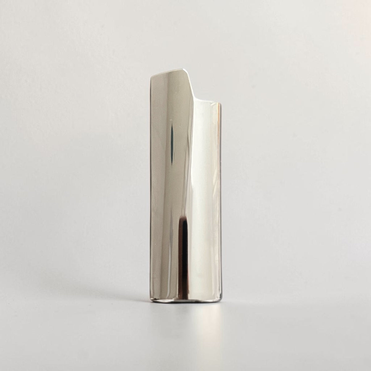 Luxury Nomad lighter case handcrafted in Sterling silver with a minimalist architectural design.