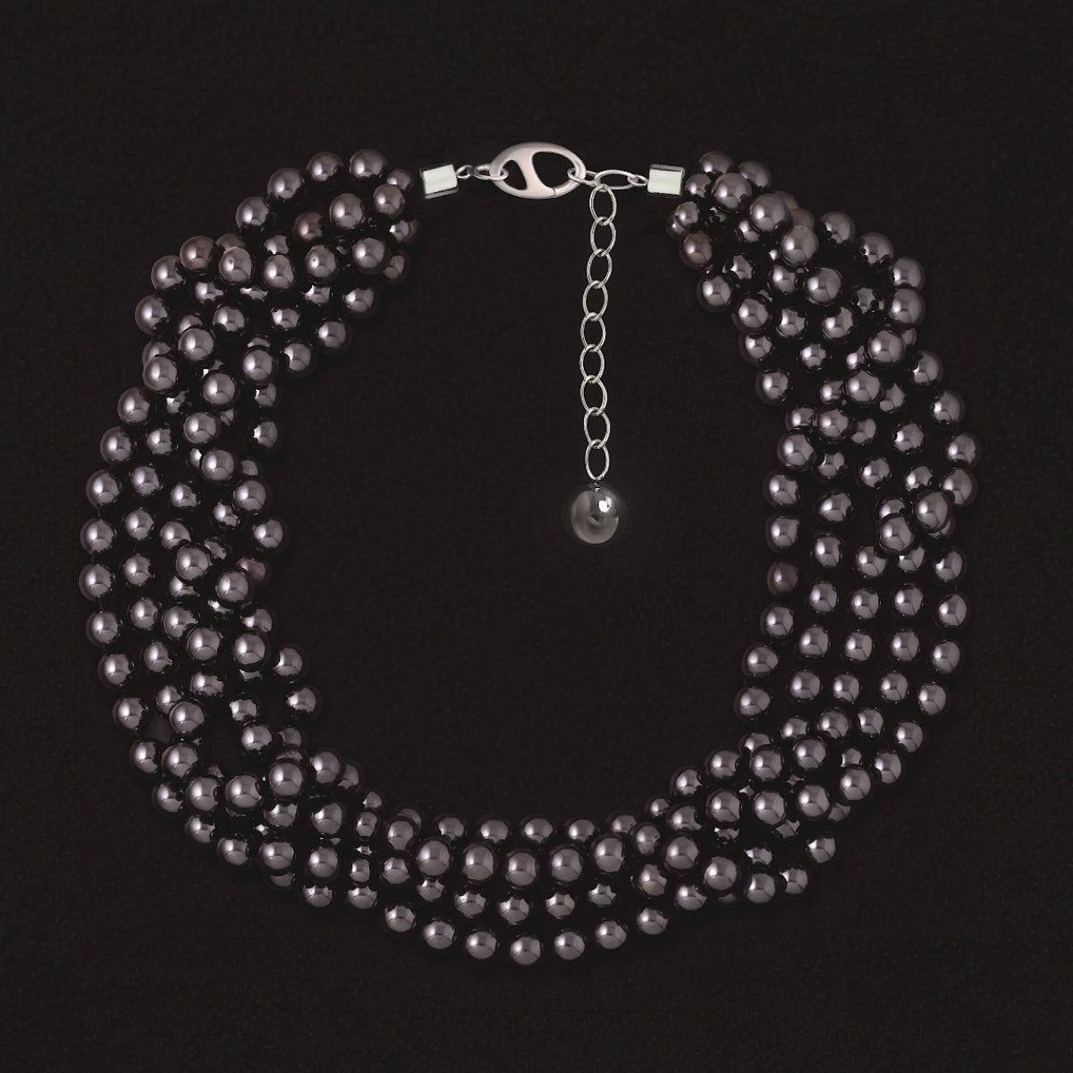 Strata luxury multi-strand statement collar necklace featuring polished hematite beads in a sculptural layered design.