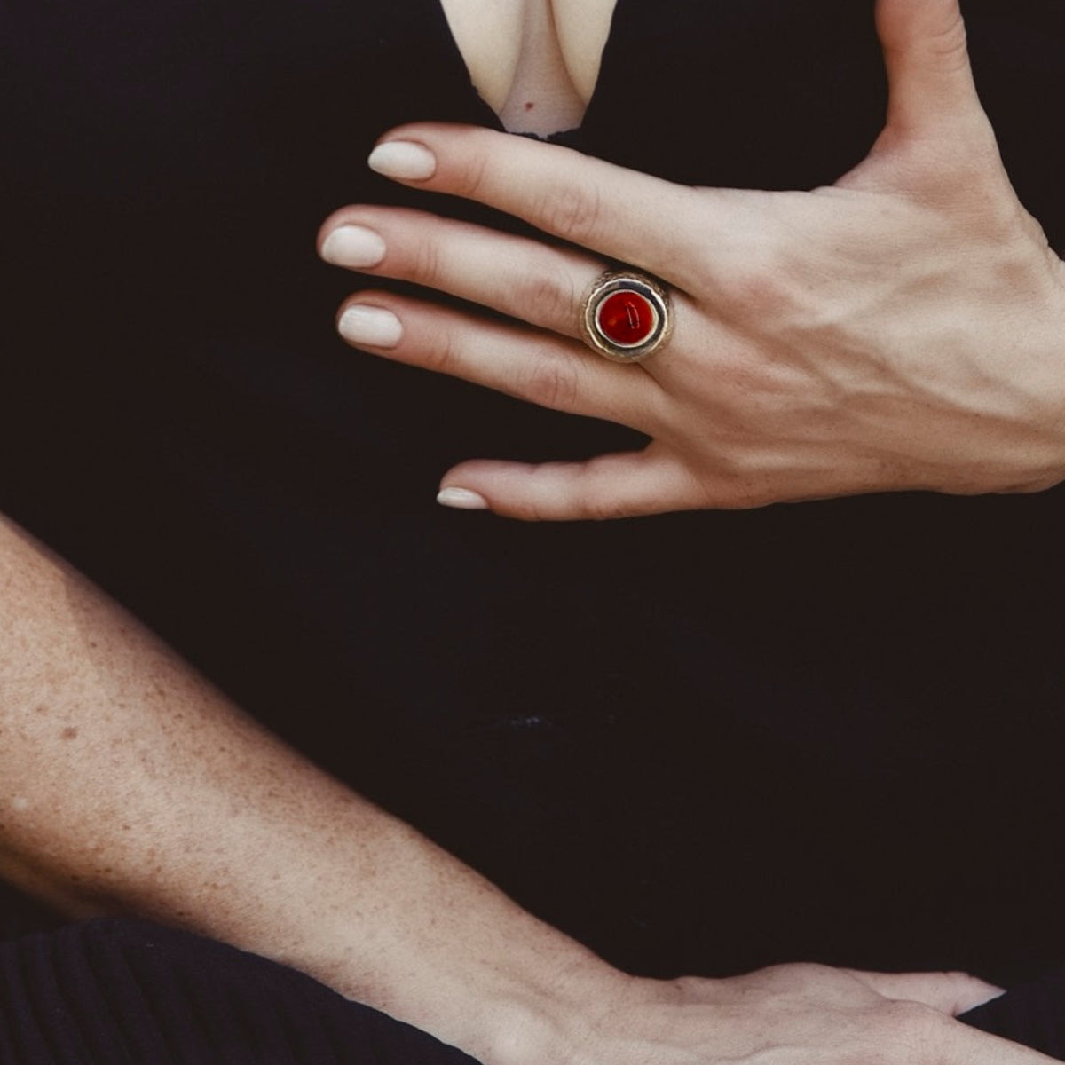 A hammered gold signet statement
 ring with a carnelian  cabochon
