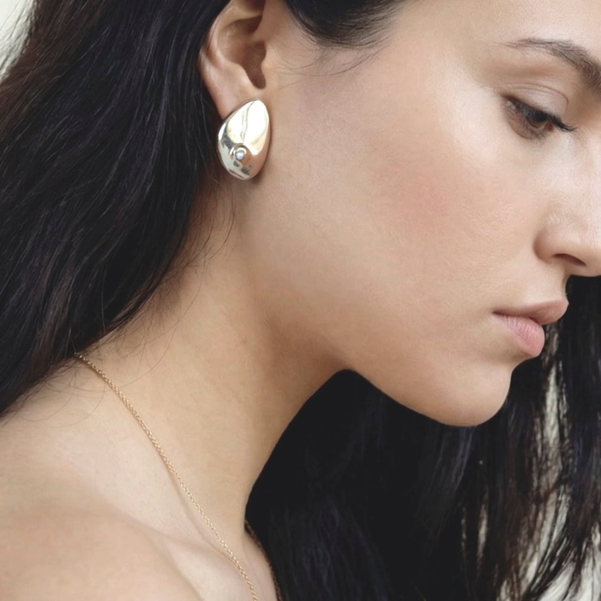 Cirque sculptural stud earrings with pearls in bronze or gold plated finish, modern minimalist pearl jewelry for everyday wear