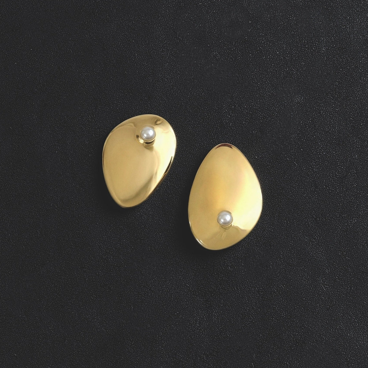 Cirque stud earrings in cast bronze with freshwater pearl, sculptural minimalist statement earrings