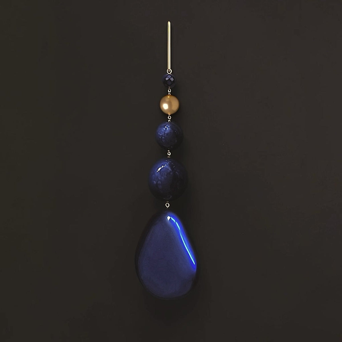 Hera sculptural statement earrings featuring polished black onyx, faceted blue lapis lazuli and delicate gold-filled chains.