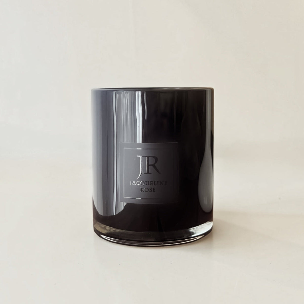 Luxury black glass scented candle hand-poured with soy wax and crackling wood wick