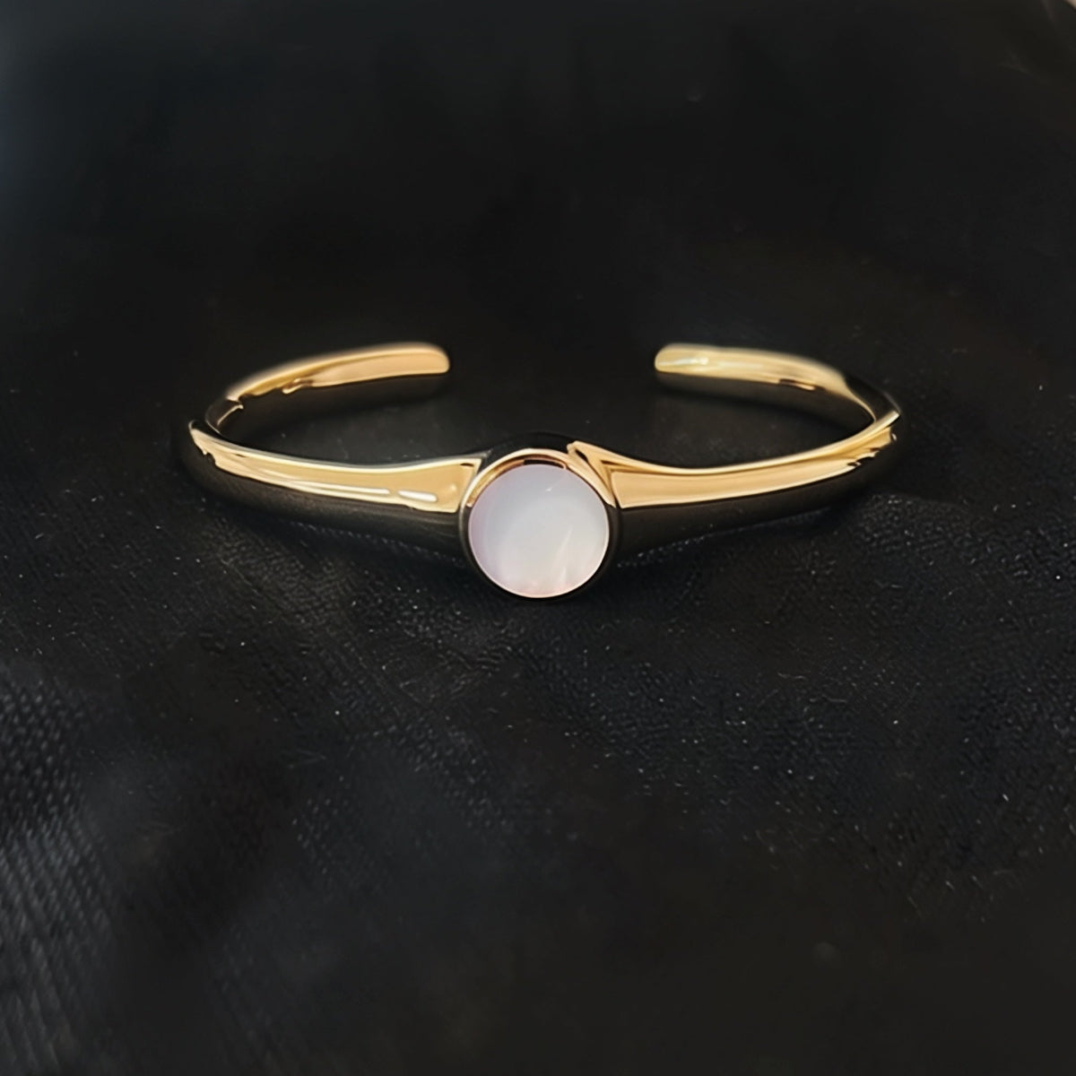Mother of Pearl cuff bracelet in sculpted bronze with luminous shell inlay