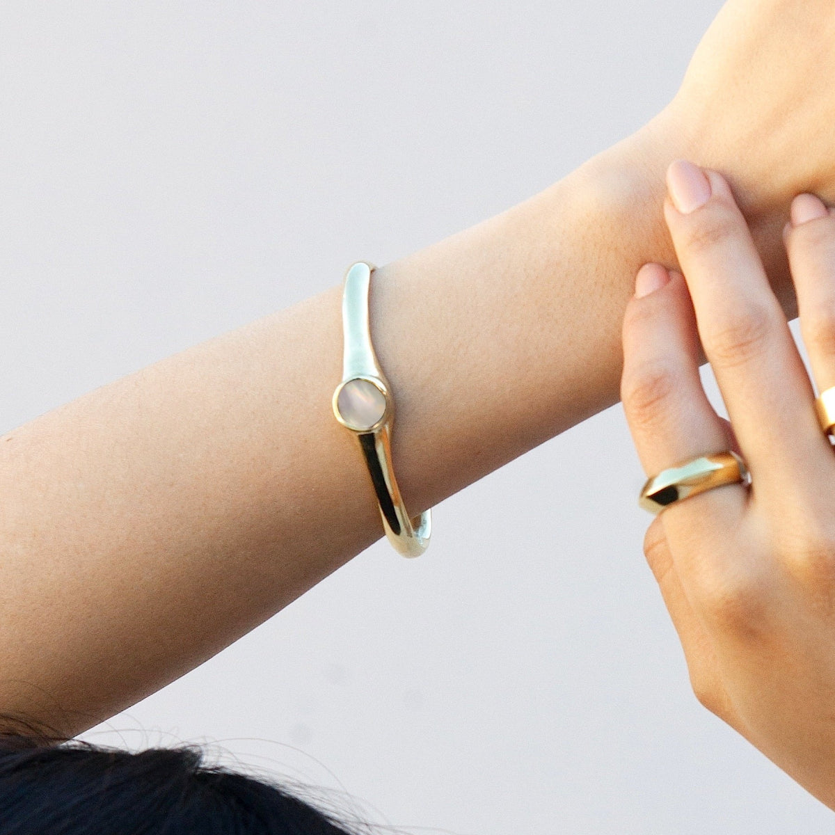 Modernist bronze cuff bracelet with natural Mother of Pearl