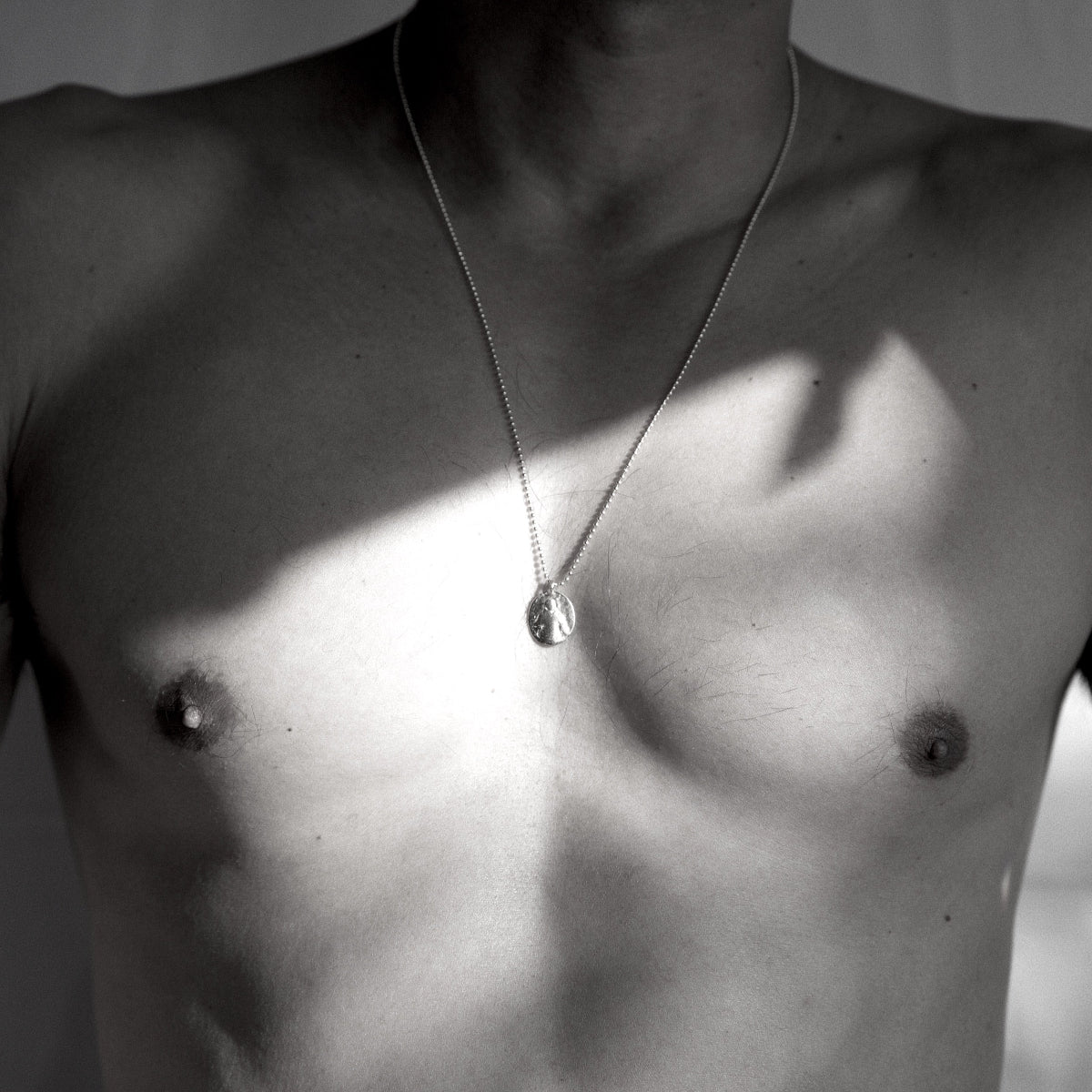 Men's Spanish Prayer Coin necklace handcrafted in Sterling silver and suspended from a 24-inch ball chain.