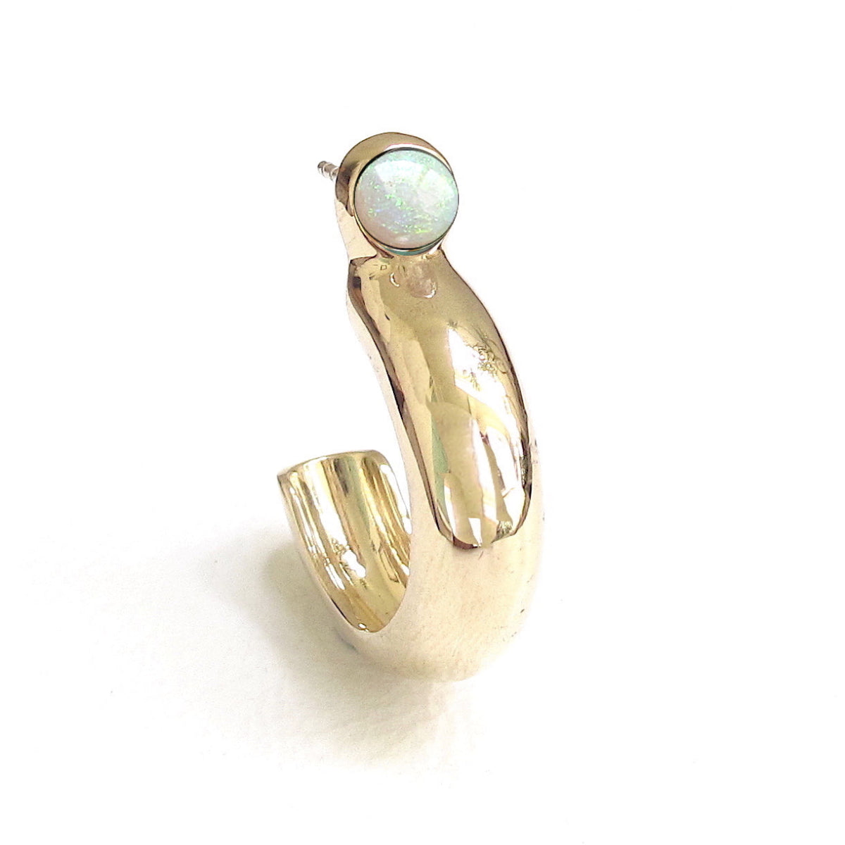 Women's Ethiopian opal cabochon hoop earrings in a high-polished gold-plated setting. Lightweight handcrafted luxury earrings and modern heirloom jewelry.