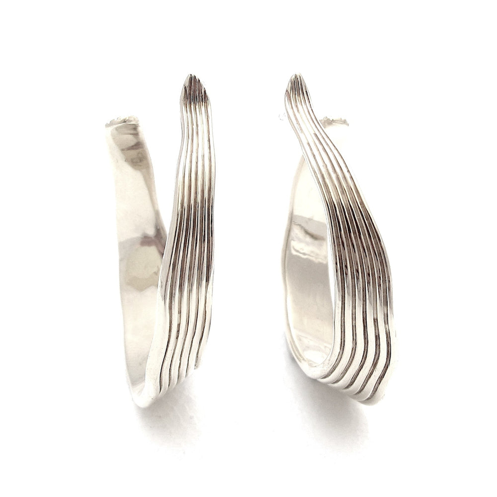 
                  
                    Ridge silver hoop earrings
                  
                