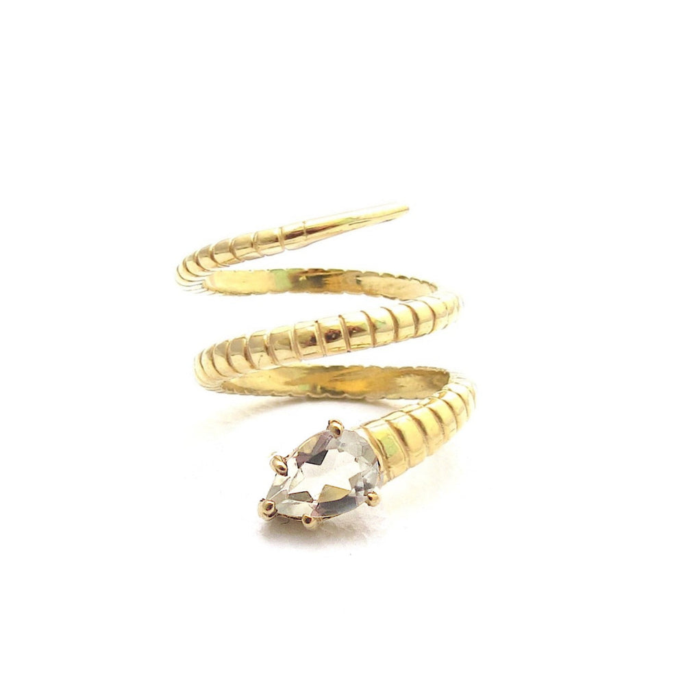
                  
                    A coiled gold snake ring featuring quartz.
                  
                